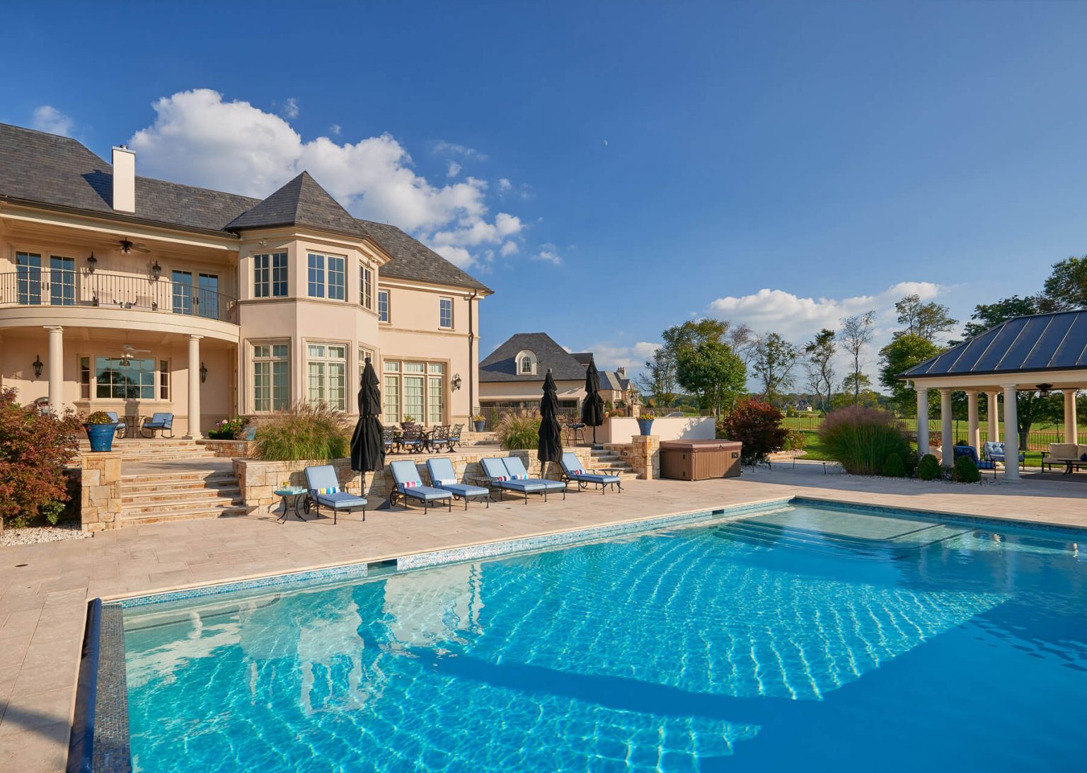 custom villa home with outdoor pool