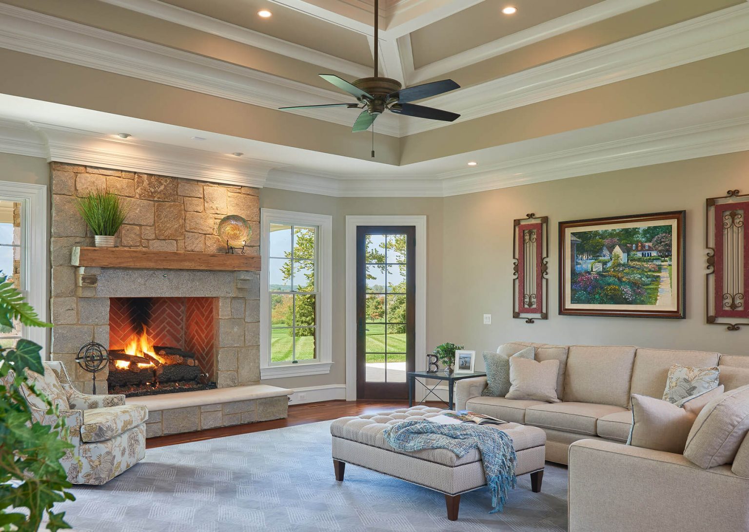 living room with high ceiling and fireplace